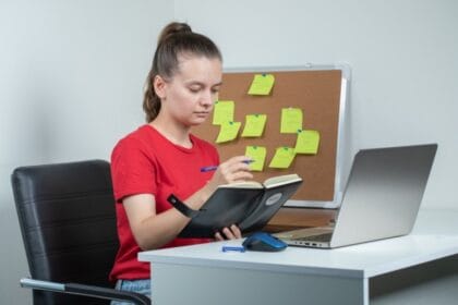 female-employee-working-laptop-taking-notes-1-1-1-1-1-1