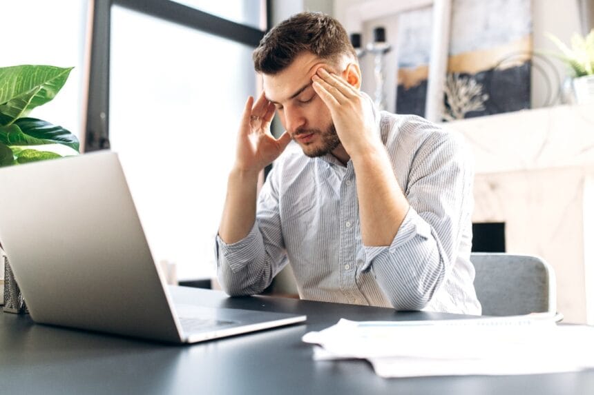 Tired-man-sitting-at-desk-may-have-sleep-apnea-in-Vero-Beach