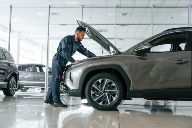 fixing-vehicle-side-view-car-repairman-is-garage-with-automobile-1