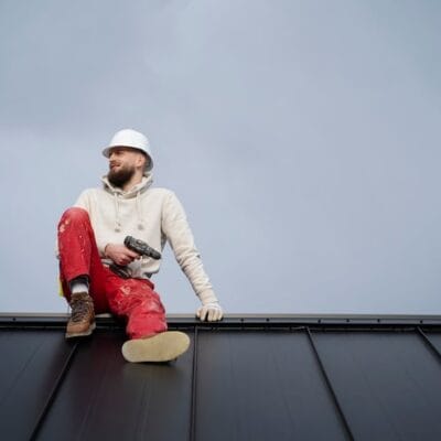 full-shot-man-sitting-roof_23-2149343640