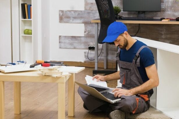 furniture-assembly-worker-uses-laptop-consult-instructions-handyman-doing-good-job_482257-24842