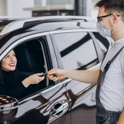 mechanic-with-client-car-service-station_1303-26916