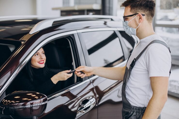mechanic-with-client-car-service-station_1303-26916