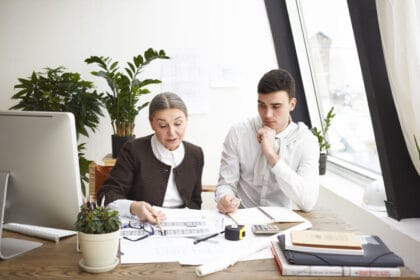 people-job-teamwork-cooperation-concept-two-professional-engineers-colleagues-sitting-desk-with-blueprints-computer-engineering-tools-discussing-plans-ideas-having-serious-looks_optimized_2000_1_optimized_250