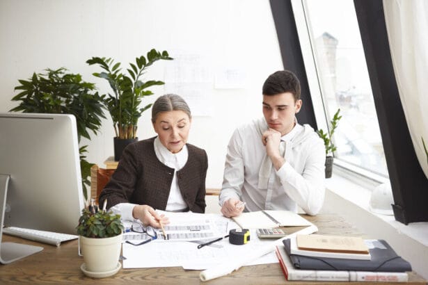people-job-teamwork-cooperation-concept-two-professional-engineers-colleagues-sitting-desk-with-blueprints-computer-engineering-tools-discussing-plans-ideas-having-serious-looks_optimized_2000_1_optimized_250