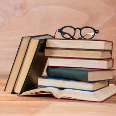 various-books-with-spectacles-table-1
