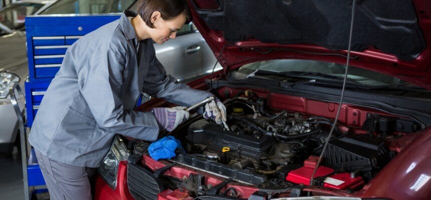 female-mechanic-checking-oil-level-car-engine-1
